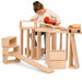 Solid wooden building blocks with a little girl playing with them bulding a road for toy trucks