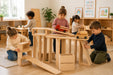 Solid wooden building block set - children playing with them in a daycare center