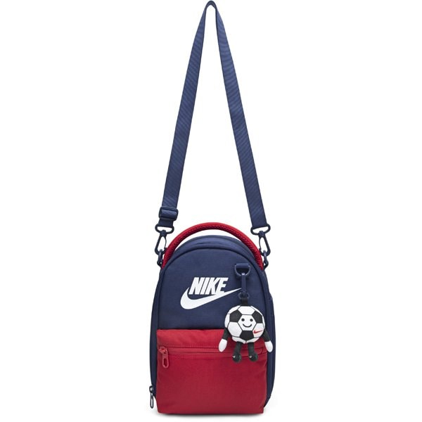 Nike kids' navy and red crossbody bag with soccer ball keychain, shown against a white background.