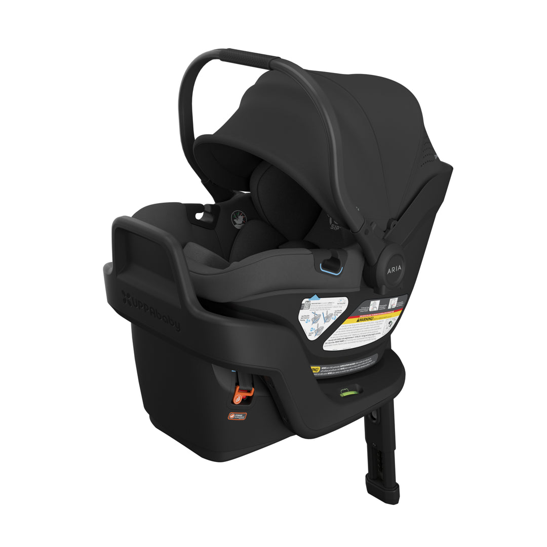 Black infant car seat with carry handle, base, and canopy, shown on white background