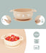 Beige silicone baby suction bowl with cute animal face, dual handles, filled with fruit, 350ml capacity, dishwasher and microwave safe