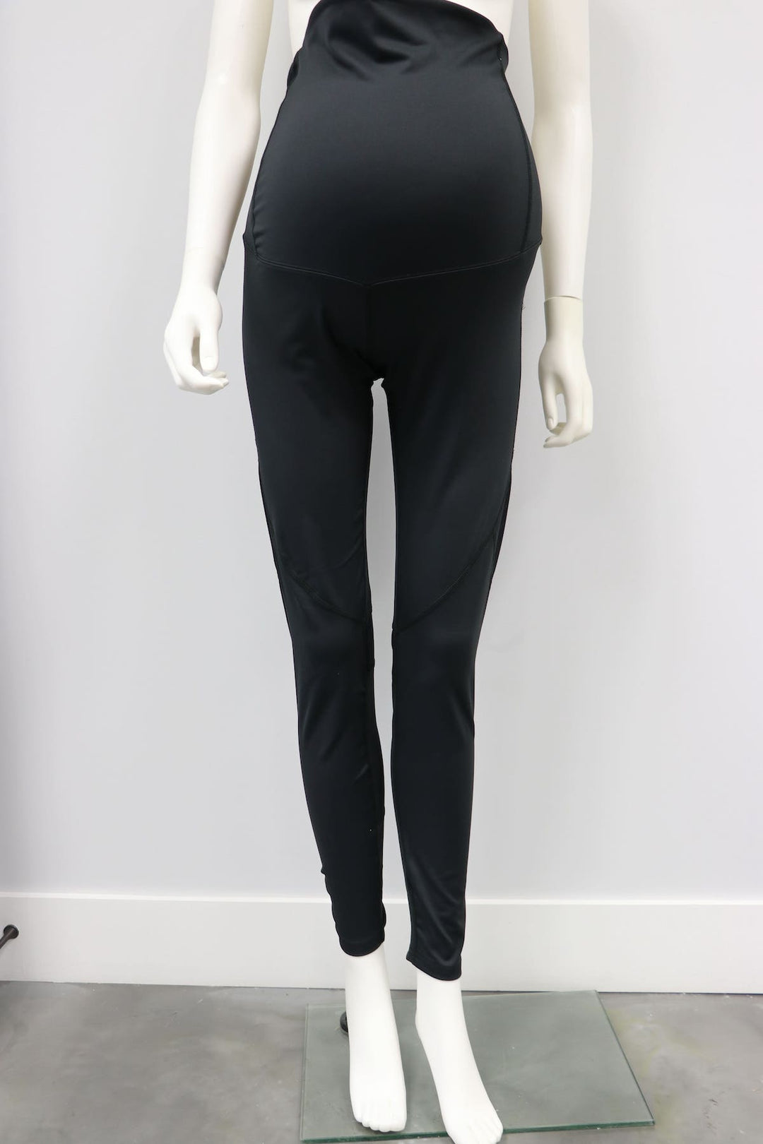 Courage maternity black leggings displayed on a mannequin against a white background.