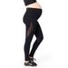 Maternity black leggings with sheer mesh panels shown on a pregnant model against a white background.