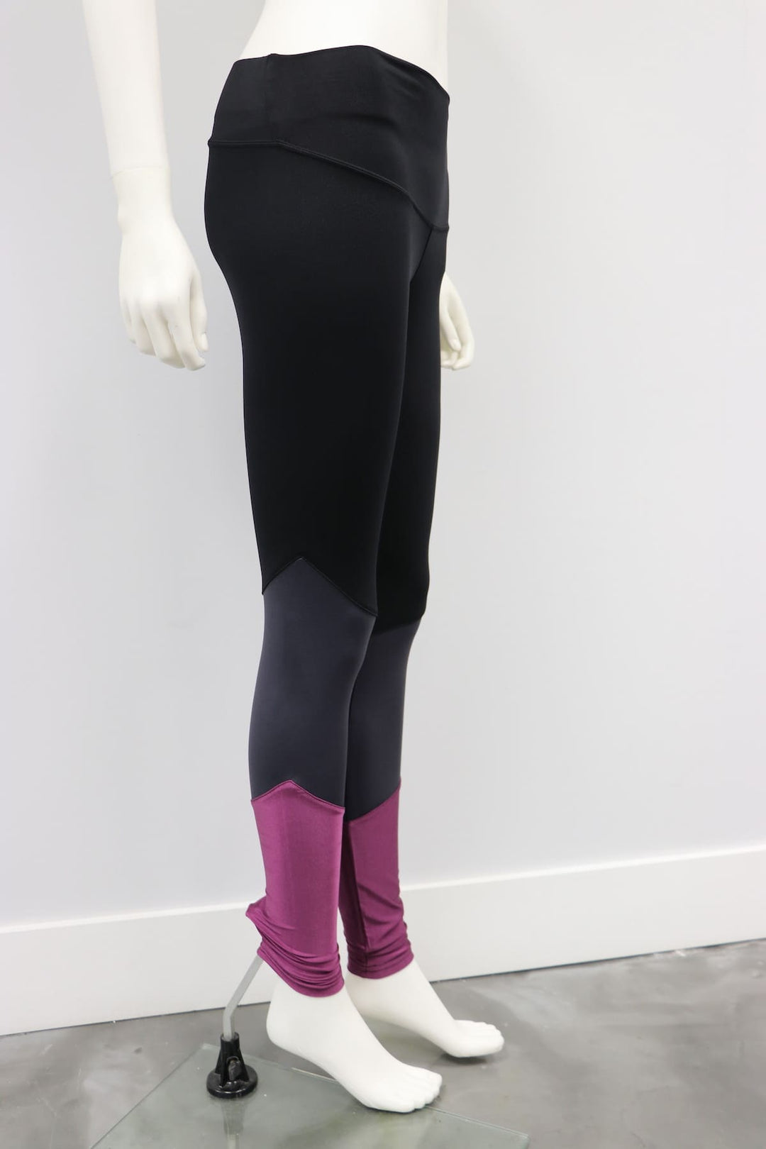 Balance Legging Black-Raisin shown on a mannequin with black, grey, and purple color block design.