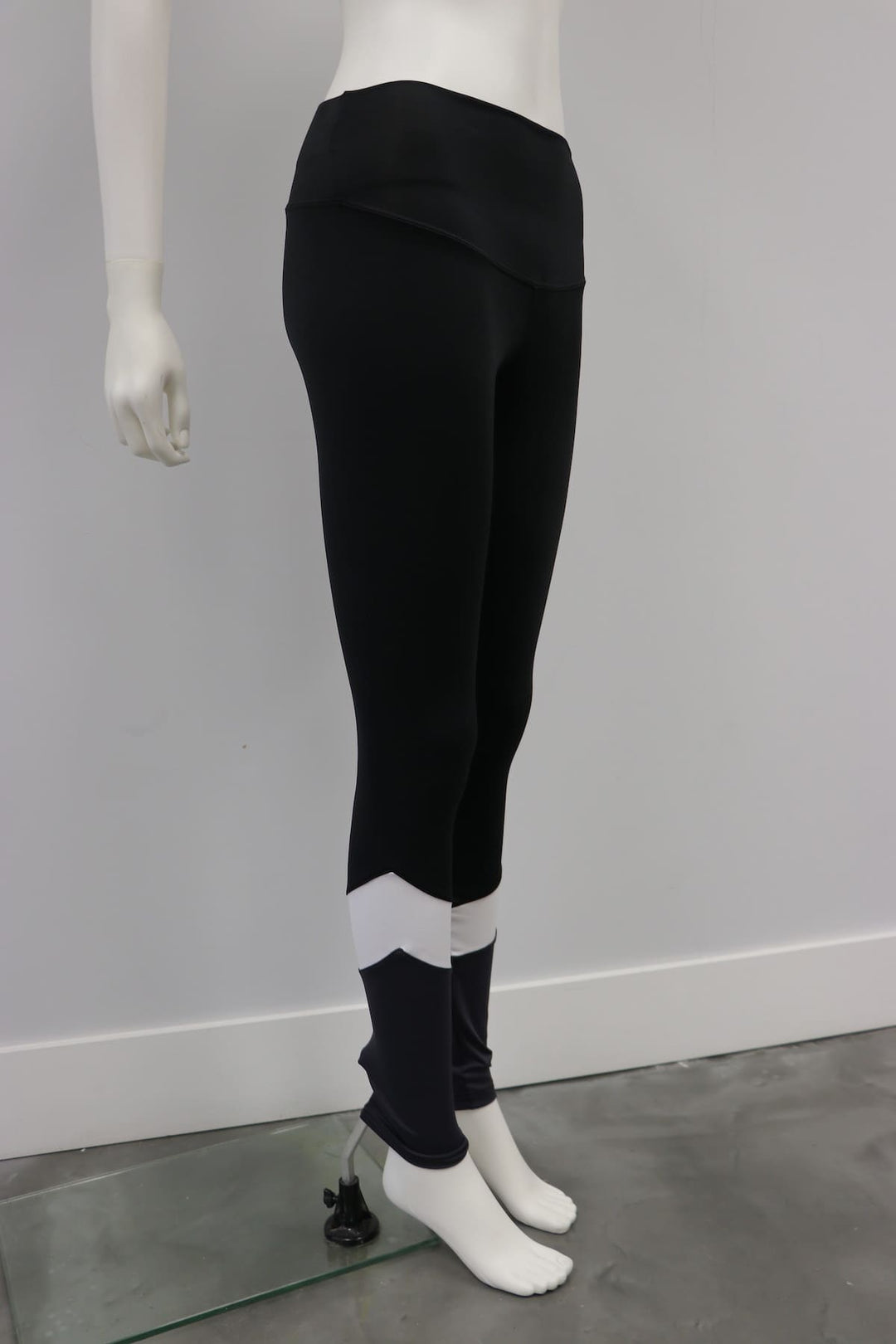 Zen Legging Black-White shown on mannequin, full length with contrasting white detail at calves.