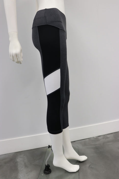 Grey Esprit leggings with black and white panels shown on a mannequin against a plain background.