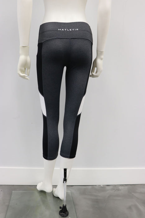 Matletik grey and black athletic leggings displayed on a mannequin from the back.