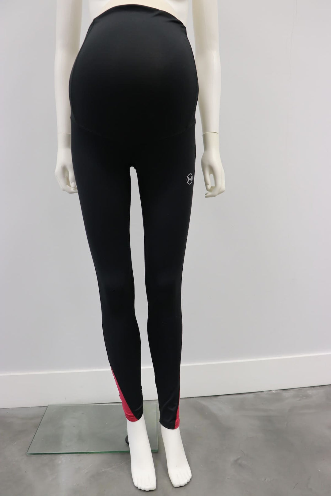 Karma Legging Black-Raspberry maternity leggings displayed on a mannequin in a plain room.