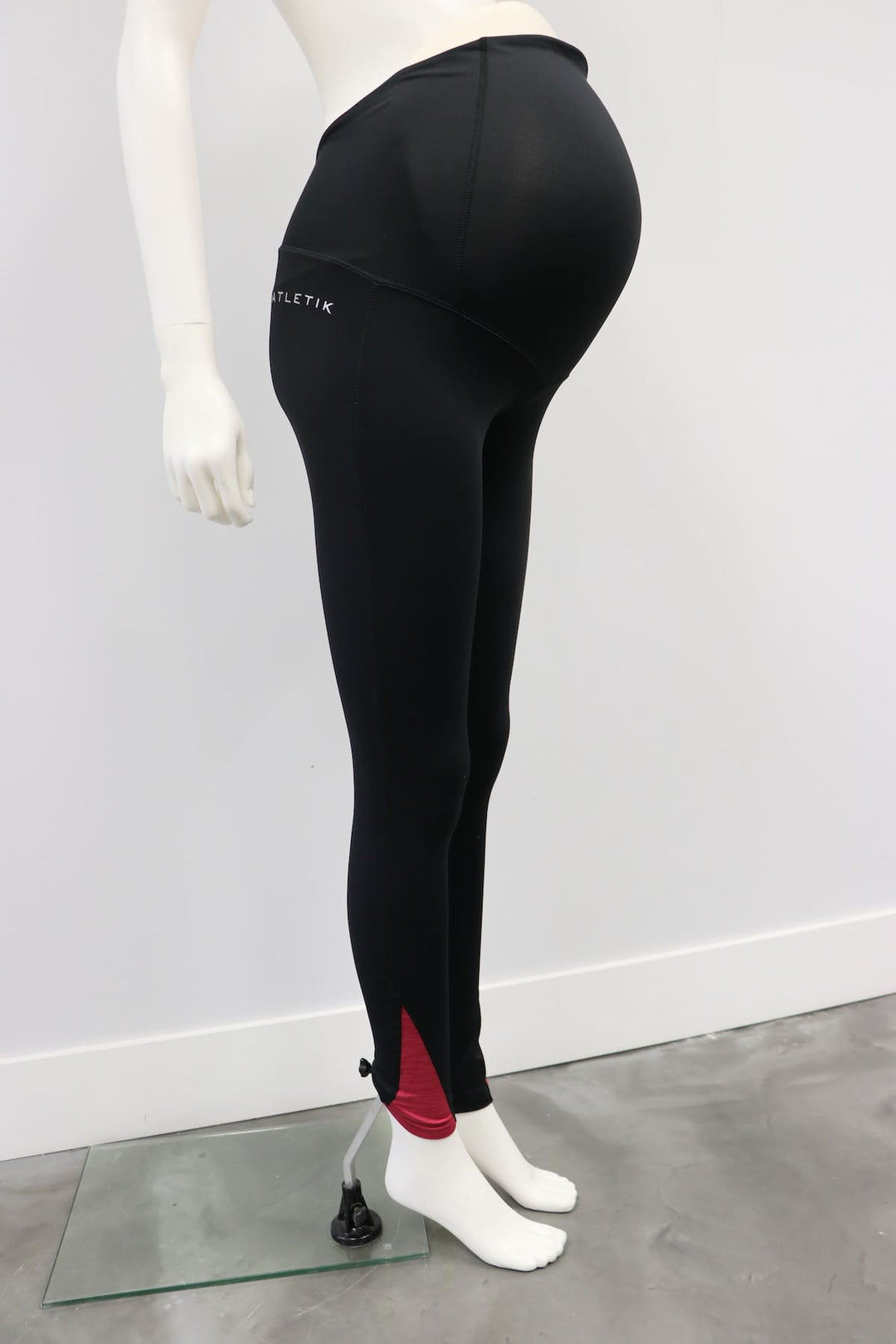 Karma Legging Black-Raspberry maternity leggings shown on a mannequin against a plain wall.