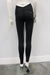 Karma Legging Black-Raspberry shown on a mannequin from the back, in a plain indoor setting.