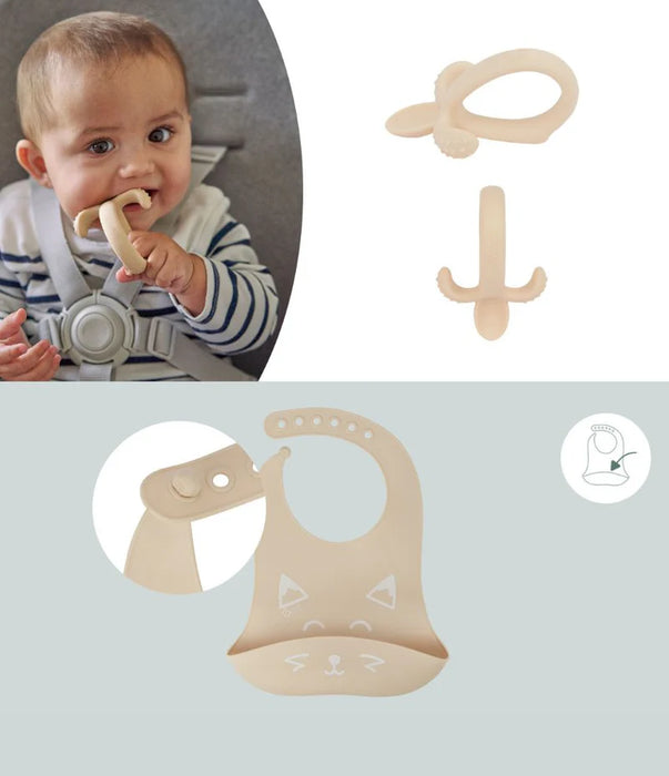 Baby using silicone teether, beige cat silicone bib and teether set for infants.