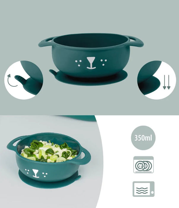 Green silicone suction baby bowl with a cute animal face, two handles, 350ml capacity.