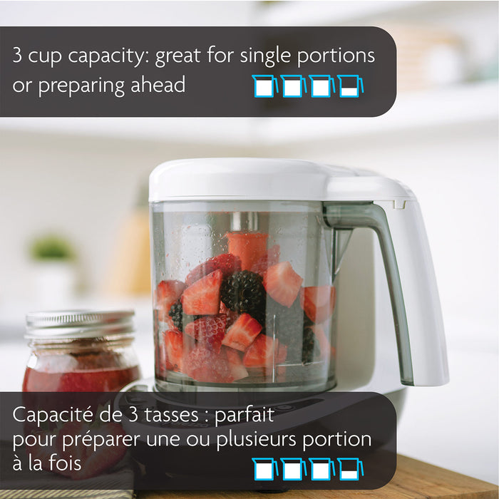 Food processor with berries and strawberries in the bowl on a kitchen counter, 3 cup capacity highlighted.