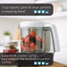 Food processor with berries and strawberries in the bowl on a kitchen counter, 3 cup capacity highlighted.