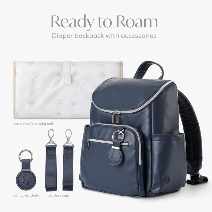 Navy blue diaper backpack with waterproof changing pad, stroller straps, and key chain accessories.