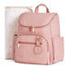 Pink diaper backpack with gold zippers and matching floral changing pad for babies