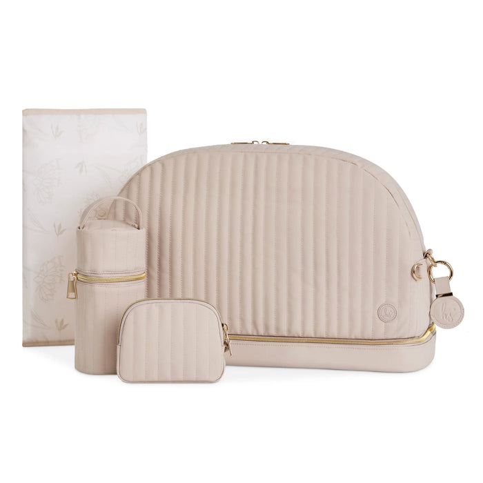 Beige quilted diaper bag set with bottle holder, pouch, and changing pad for babies