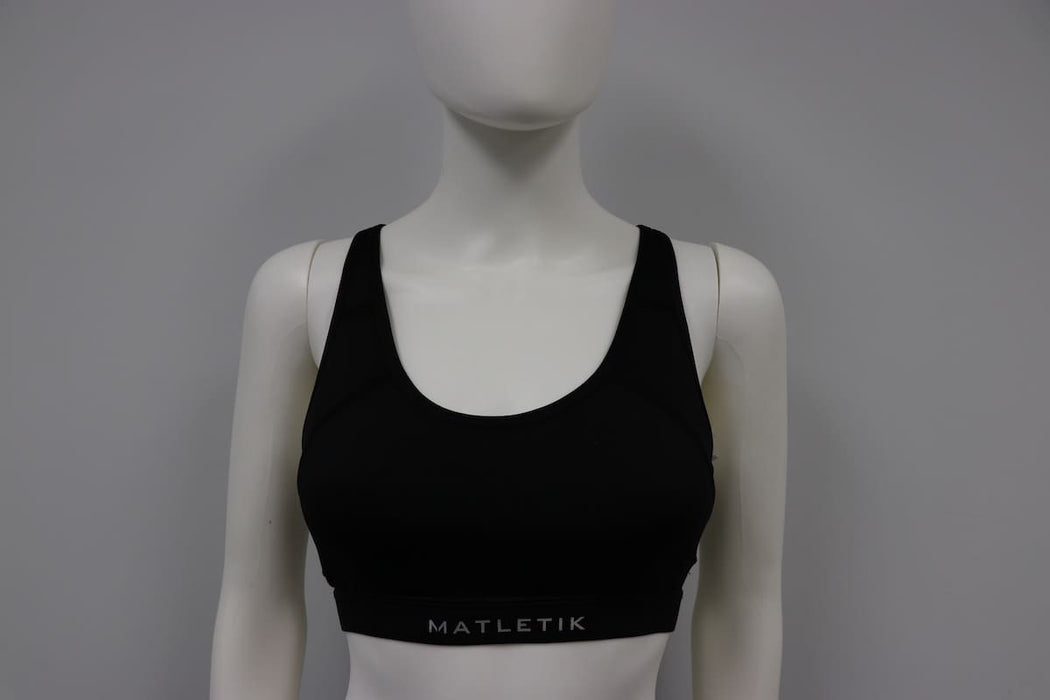Matletik black bra top displayed on mannequin against plain background.