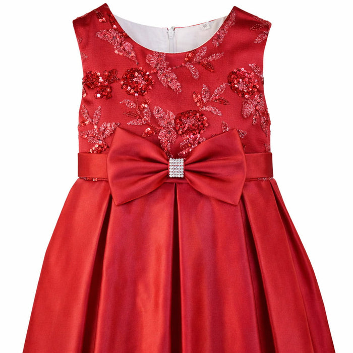 Red party dress for girls with sequin floral bodice and large satin bow shown on white background.