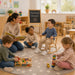 Economy solid maple wooden rocking chair for kids - Little boy on the rocking chair at daycare with children ardound