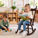 Solid wood kids daycare rocking chair in a daycare center with children playing - Goldtex