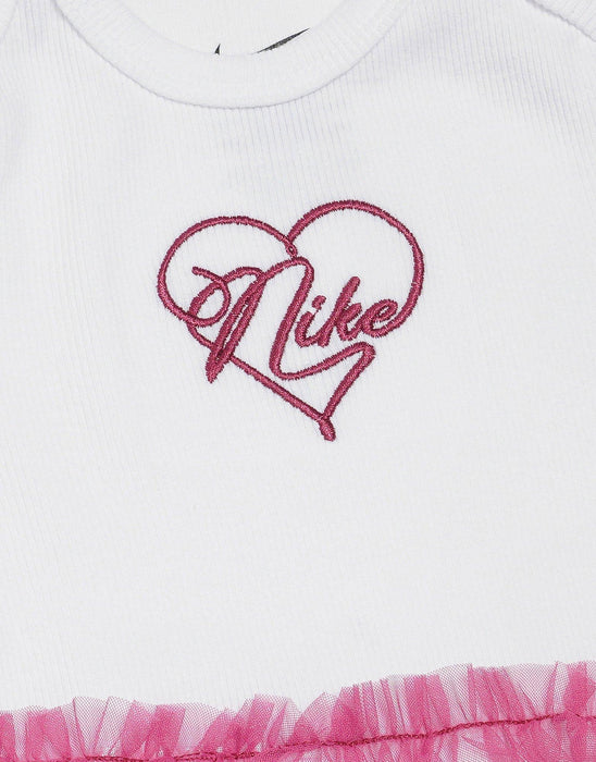 Nike baby dress with pink heart logo embroidery and pink tulle ruffle detail, close-up view.