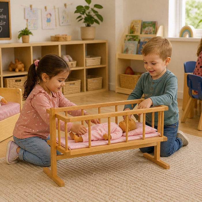 2 kids playing with the solid wood cradle and a doll - Goldtex