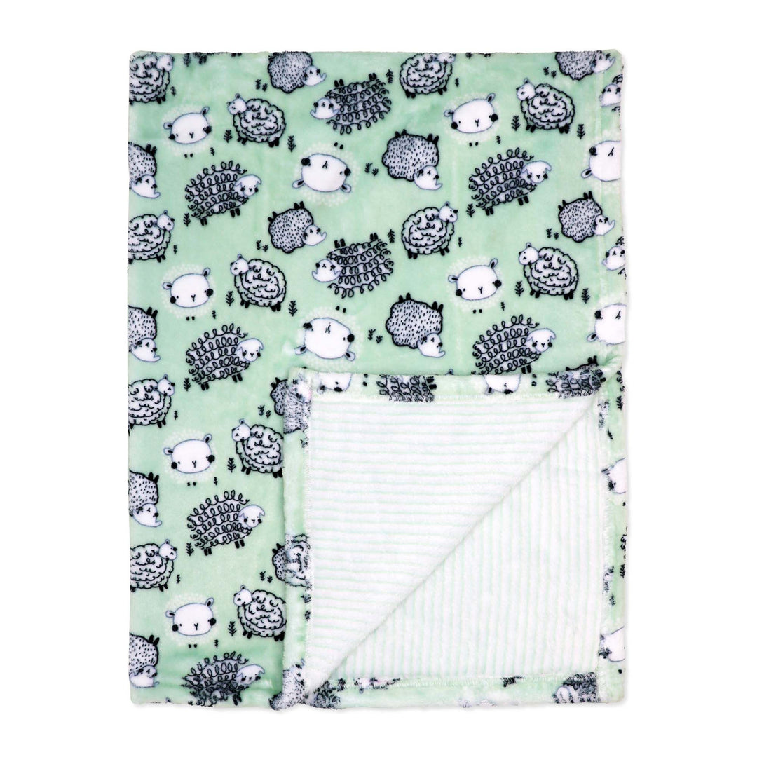 Mint green baby blanket with sheep pattern shown flat with corner folded to reveal soft inner lining.