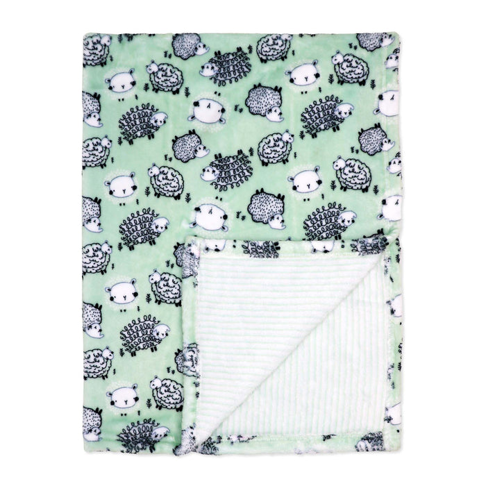 Mint green baby blanket with sheep pattern shown flat with corner folded to reveal soft inner lining.