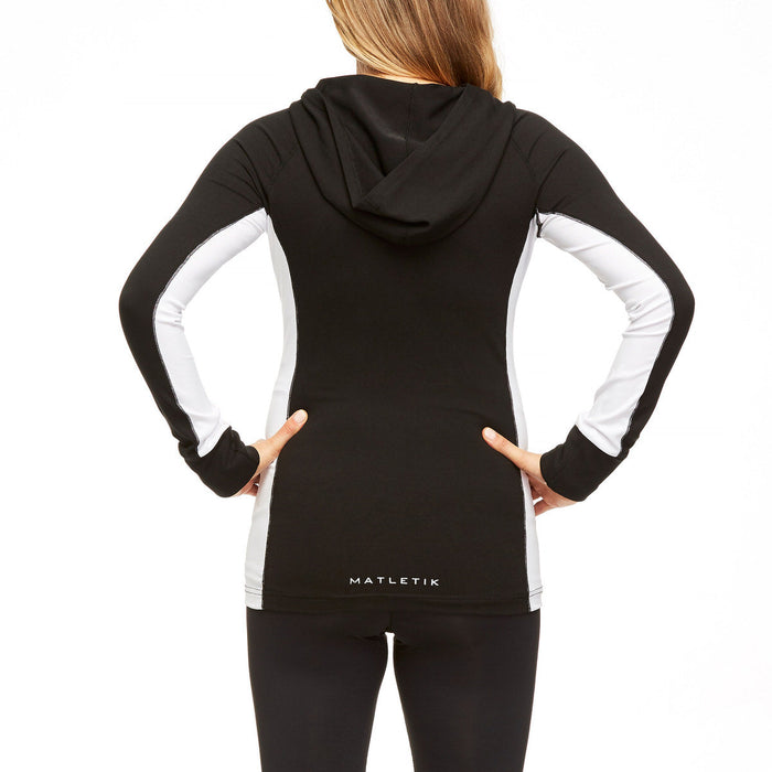 Matletik maternity active hoodie in black and white, shown worn from the back by a woman standing.