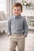 Elevate Oxford Shirt in grey shown on a young boy standing in a bright, elegant living room.