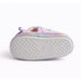 Girls Paw Patrol slippers showing the non-slip rubber sole in a studio setting.