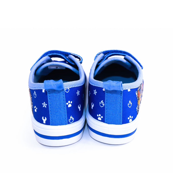 Paw Patrol boys canvas shoes shown from the back, blue with white paw and tool prints.