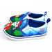 Paw Patrol boys slip-on canvas shoes with cartoon character print, displayed on a white background.