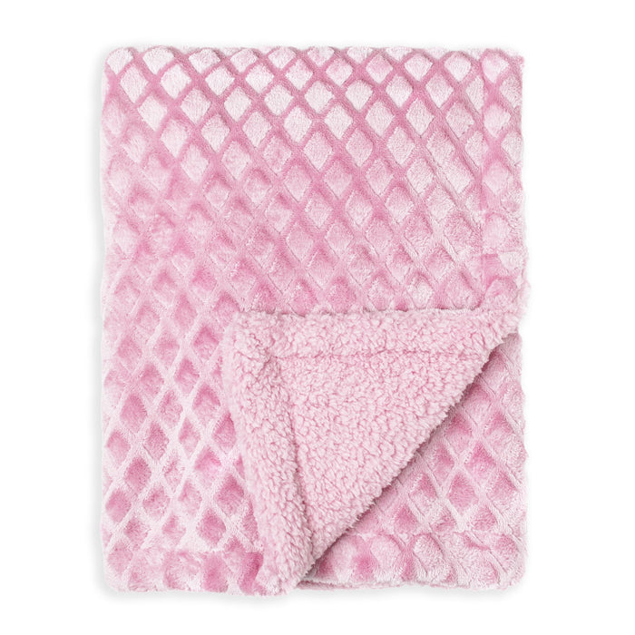 Baby blanket in soft pink with diamond pattern, shown folded with one corner revealing plush lining.