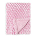 Baby blanket in soft pink with diamond pattern, shown folded with one corner revealing plush lining.