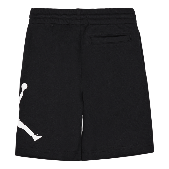 Black kids' shorts with white logo detail, elastic waistband, and single back pocket on plain background.