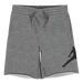 Boys’ grey athletic shorts with elastic waistband and black sporty graphic, shown on flat surface.