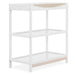 White wooden baby changing table with two shelves and natural wood accent