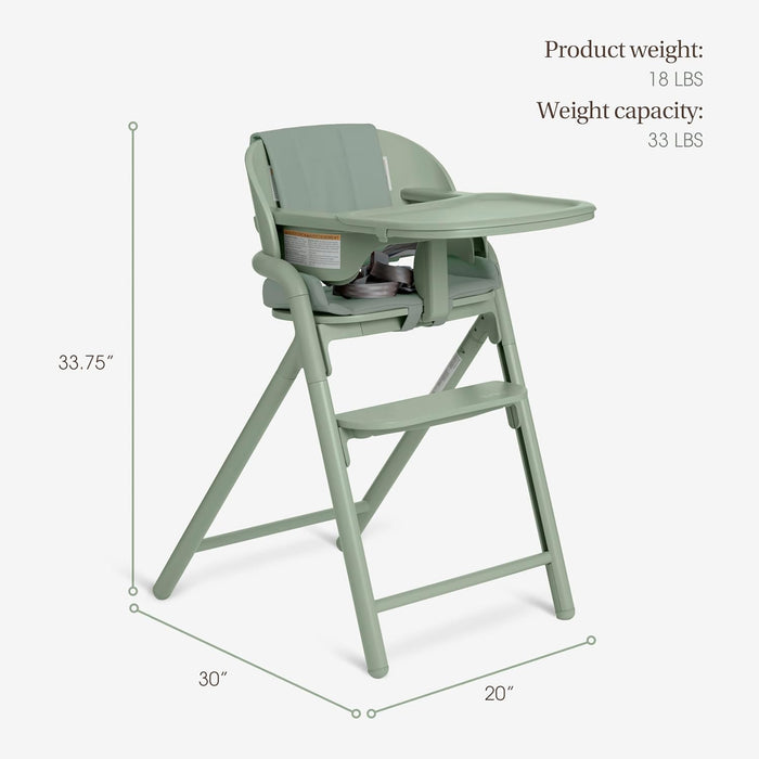 Sage green baby high chair with tray, adjustable footrest, and product dimensions