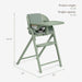 Sage green baby high chair with tray, adjustable footrest, and product dimensions