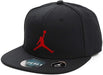 Black youth snapback cap with red Jumpman logo, shown angled on a white background.