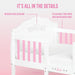 White and pink baby crib with rose detailing and dual-tone finish, ideal nursery furniture
