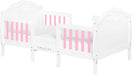 White and pink toddler bed with floral details and Barbie logo, perfect for kids' bedrooms