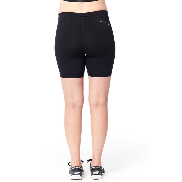 Matletik black maternity bike shorts shown on a model standing against a white background.