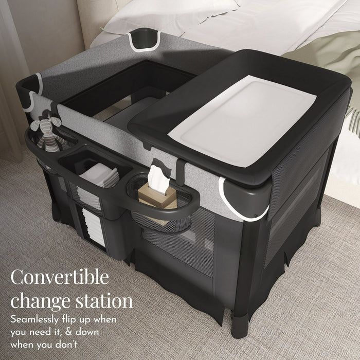 Convertible baby changing station with storage, diapers, and wipes in a nursery setting