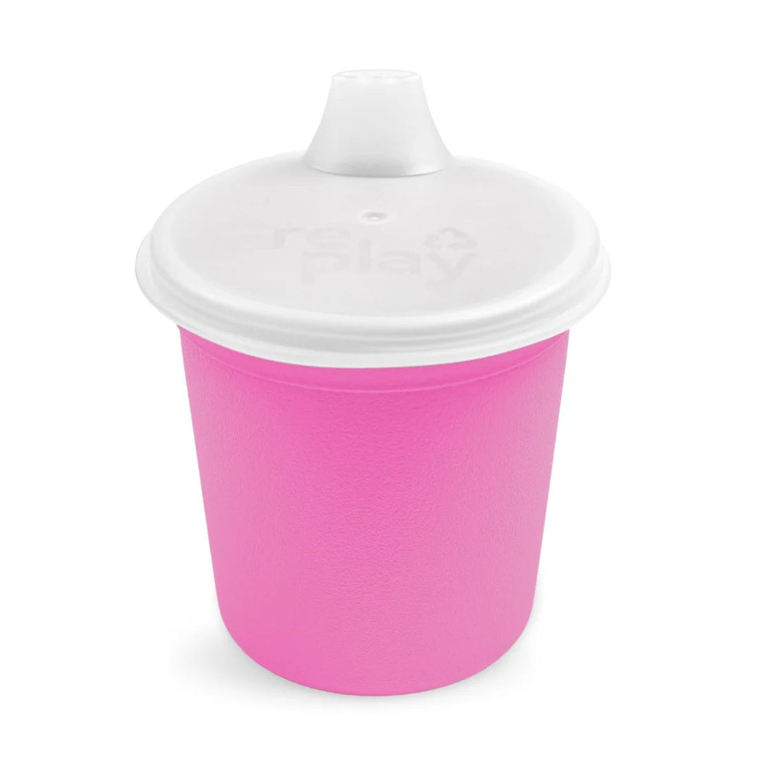 Bright pink toddler sippy cup with white spill-proof lid