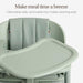 Light green baby high chair with cushioned seat and removable tray for easy cleaning