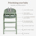 Green adjustable baby high chair with safety harness, removable tray, footrest, and cushioned seat.