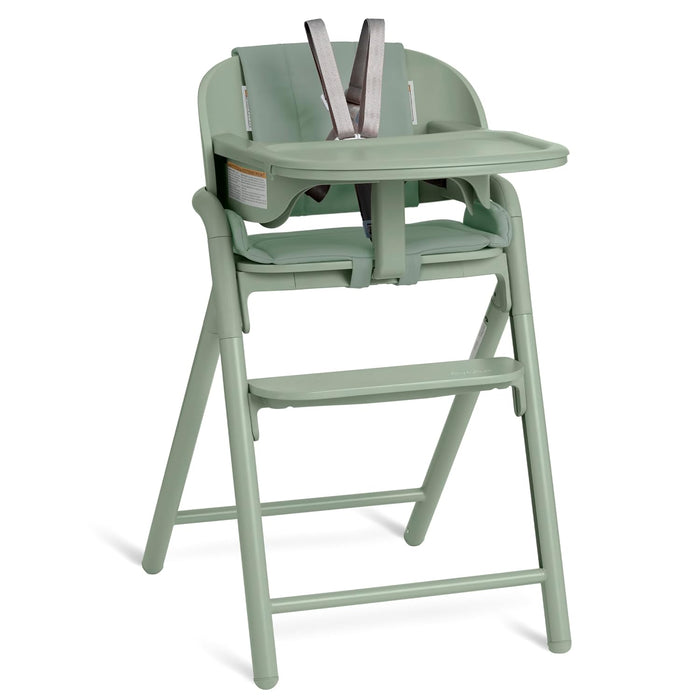 Sage green baby high chair with tray, footrest, and safety harness for feeding